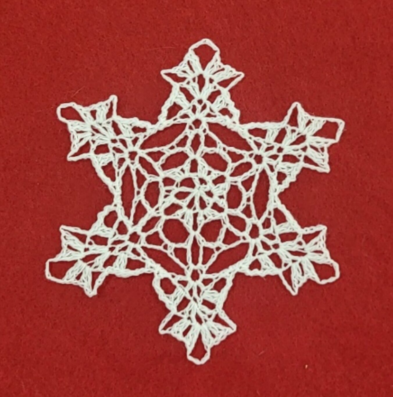 crocheted snowflake on red background, snowflake, snowflake on red background, crocheted snowflake